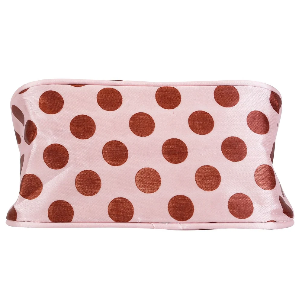 Pink satin cosmetic bag with large brown polka dots, ideal for makeup organization and travel accessories.