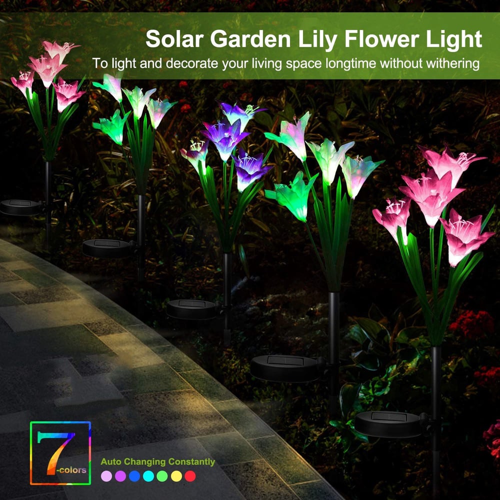 Solar garden lily flower lights in vibrant colors illuminating a pathway, designed to enhance outdoor spaces with a decorative and low-maintenance lighting solution.